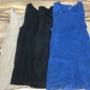 4 pack Mens muscle tanks. Larges